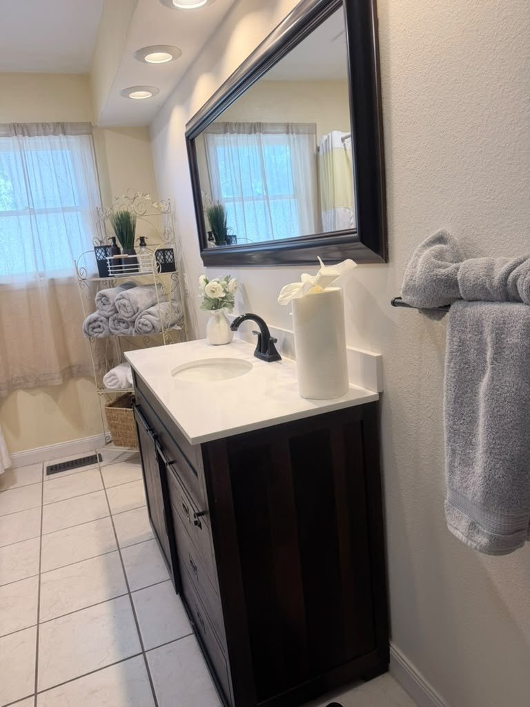 Clean bathroom sink and mirror — Madeline’s Cleaners